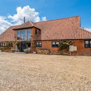 A stunning £1.1 million barn conversion in the Norfolk countryside has gone up for sale