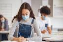 The government's announcement came on Sunday to reintroduce masks into classrooms in secondary and higher educational settings. Picture: Getty Images/iStockphoto