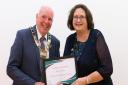 Roy Brame presents an award to Dereham Community Crafters