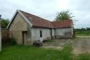 One of the agricultural buildings up for sale in Carbrooke, near Thetford, with permission to convert