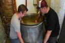 Norwich Amateur Brewers Jack Davison and Will Gant brewing a new beer which they will be selling to raise money for the NHS.