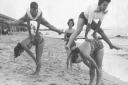 Leapfrogging on the beach in Lowestoft in the 1950s. Photo: Archant