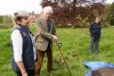 Donna Baldwin, left, general manager, with Sir Henry Paston-Bedingfeld, and Dea Fischer, senior gardener, at the planting of a linden tree to commemorate the King's coronation, at Oxburgh Hall.