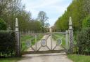 The gated private road to Hilborough House.