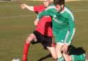 Action from Watton United's CS Morley Cup semi-final against Long Stratton Reserves (red).