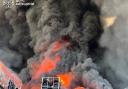 Firefighters tackle a blaze at a warehouse following a Russian drone attack near Kyiv (Ukrainian Emergency Service/AP)