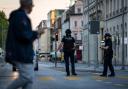 Police officers patrol a street in downtown Aarau (Michael Buholzer/Keystone via AP)