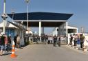 People gather outside the port of Kyrenia (AP)