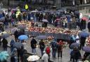 Flowers and cards are laid at the Blue Stone in Bergen (Silje Katrine Robinson /NTB Scanpix/AP)