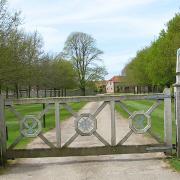 The gated private road to Hilborough House.