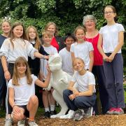 Diss Junior Academy pupils with Emma Conway, from Dipple and Conway, headteacher Jo Cerullo and teacher Mrs Gooch, with their T.rex model.