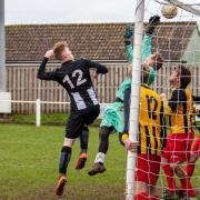 Swaffham Reserves' Harry Porter looks on as his effort clips the underside of the bar during Saturday's win over Hemsby Picture: EDDIE DEANE
