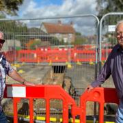 George Fuller and Peter Simmonds are unhappy at the progress of work in Saham Road, Watton.