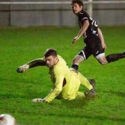 Alex Vincent steers the ball past the Debenham LC keeper  to score what proved to be the winning goal for Swaffham Town at the weekend Picture: EDDIE DEANE