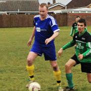 Action from Watton United's (green) 5-0 win at Feltwell.