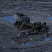 A half submerged lorry on the bank of the Trishuli River (Niranjan Shrestha/AP)