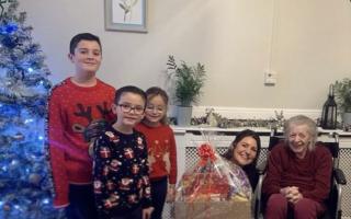 Jenna Deacon, who runs Nails at No.8 in Watton, along with her three boys, Rocky, Isaac, and Bow delivering 30 handmade hampers to people